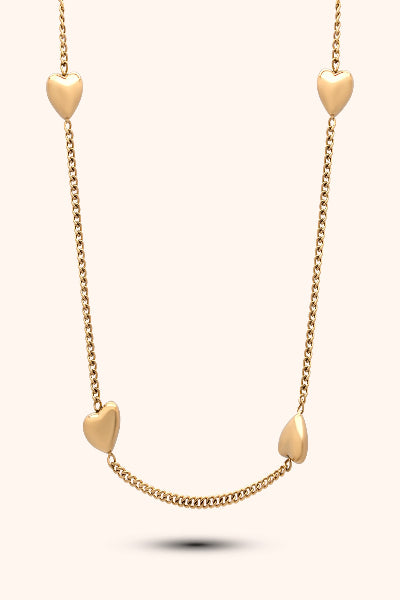 Pressie Gold necklace with heart-shaped pendants on a white background