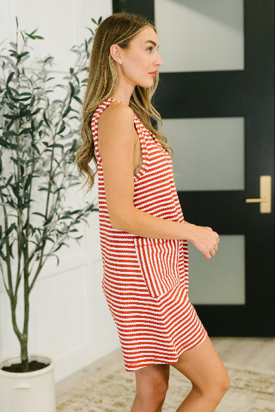 Side view of ribbed knit romper with relaxed fit and short inseam