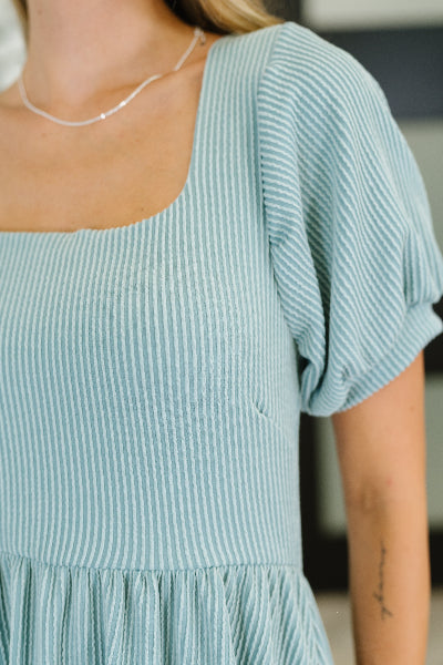 Detail of balloon sleeve and ribbed texture on Twirlin' Dirty knit dress