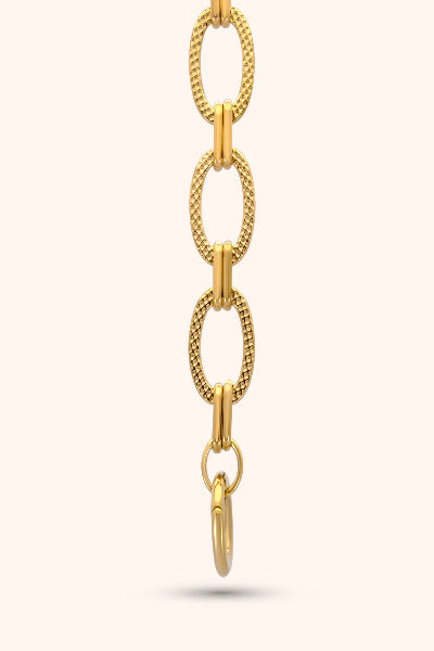 Gold chain necklace on a white background