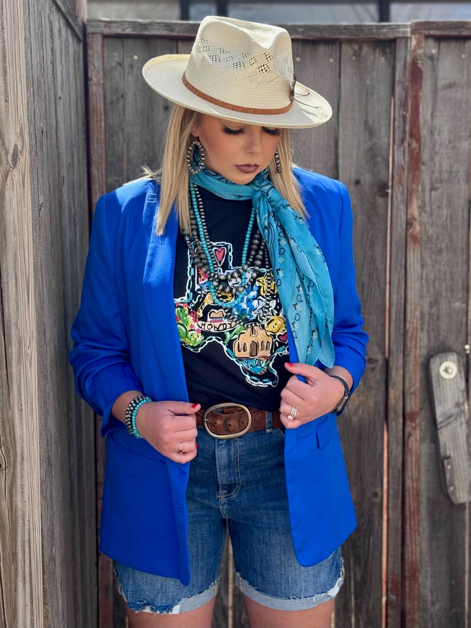 Callie Ann Stelter Texas Icons Tee – Hand-Painted Texas Pride front facing blue blazer looking down