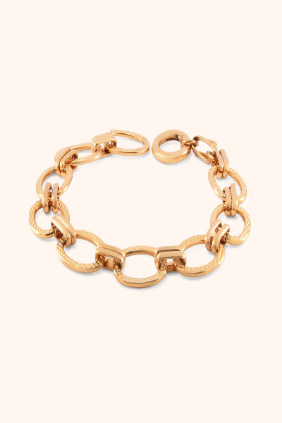 Gold chain bracelet on a white background