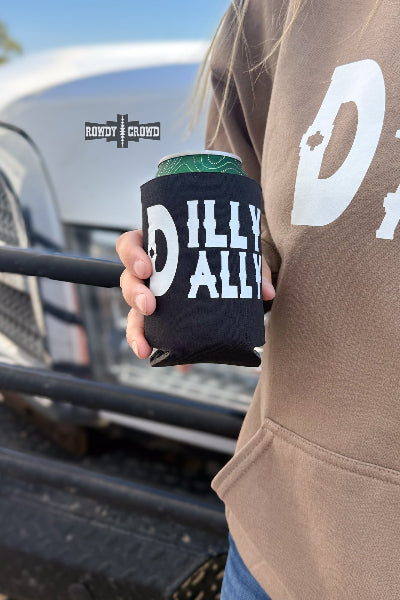A person in a brown hoodie holds a black can cooler with a green can inside. The cooler has a large white 'D' and the words 'DILLY ALLY' printed on it.