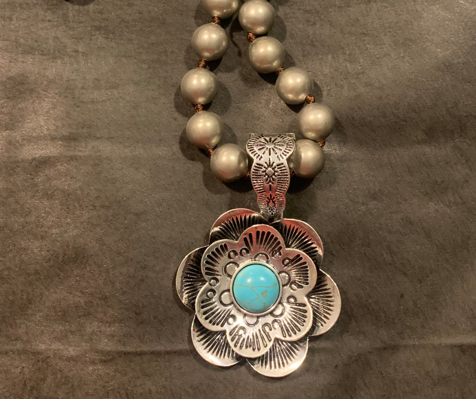 Handmade Etched Flower pendant with howlite turqoise on a Navajo pearl necklace