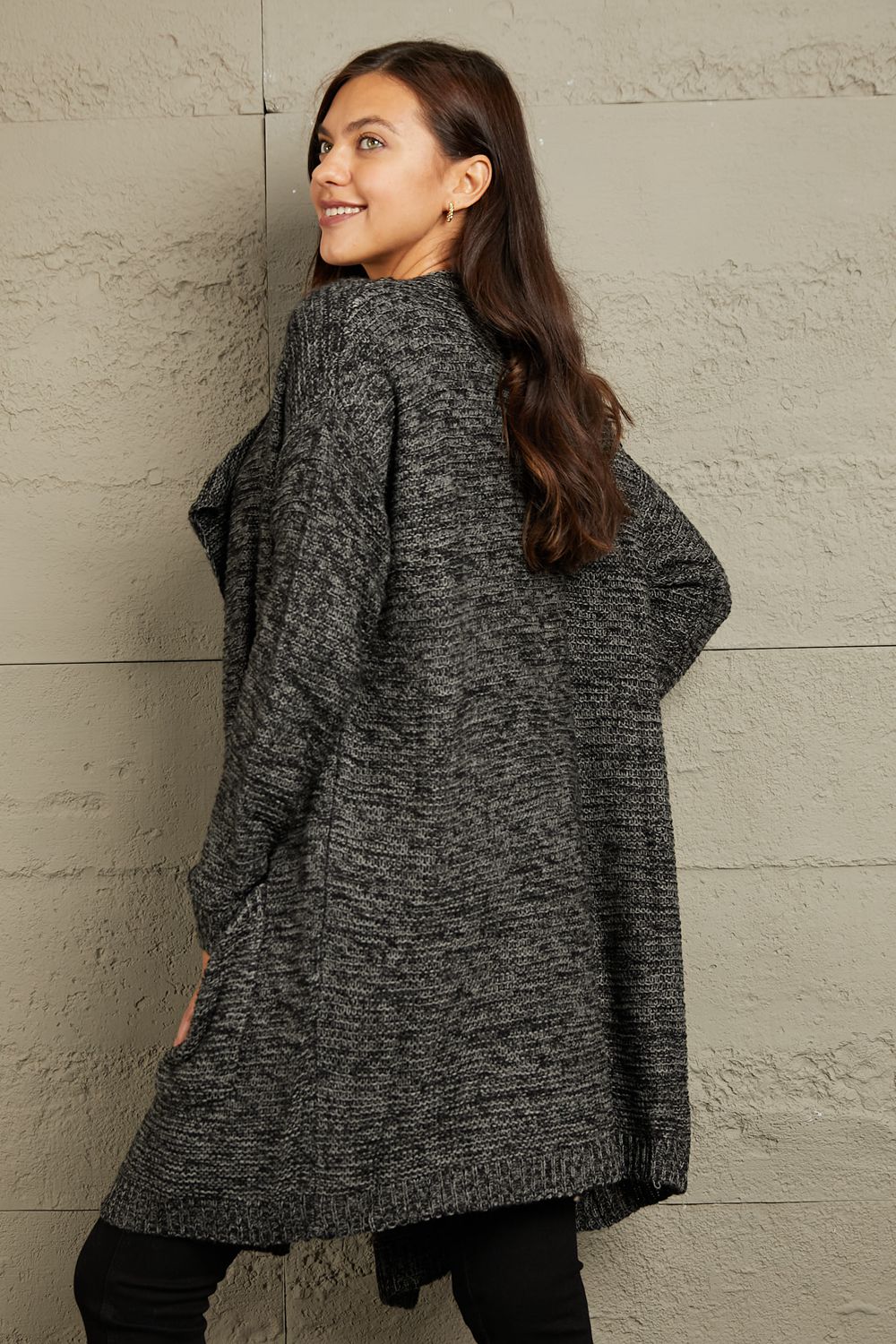 This cardigan envelops you in warmth while exuding a relaxed, yet chic vibe. Its chunky knit texture adds a touch of rustic charm, making it a versatile piece for both casual outings and snug nights in.