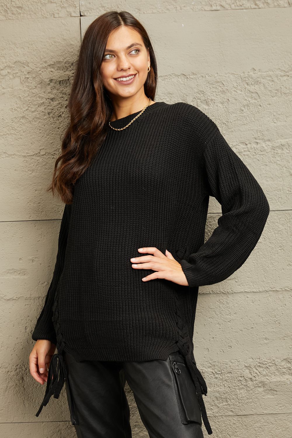 This sweater boasts a luxuriously thick and soft knit that wraps you in warmth during chilly days. Its versatile design effortlessly complements any ensemble, whether you're dressing up for a night out or keeping it casual for a weekend stroll. The chunky texture adds a touch of sophistication, while the tunic length provides a flattering silhouette. Elevate your wardrobe with this must-have piece that promises both comfort and fashion-forward elegance.