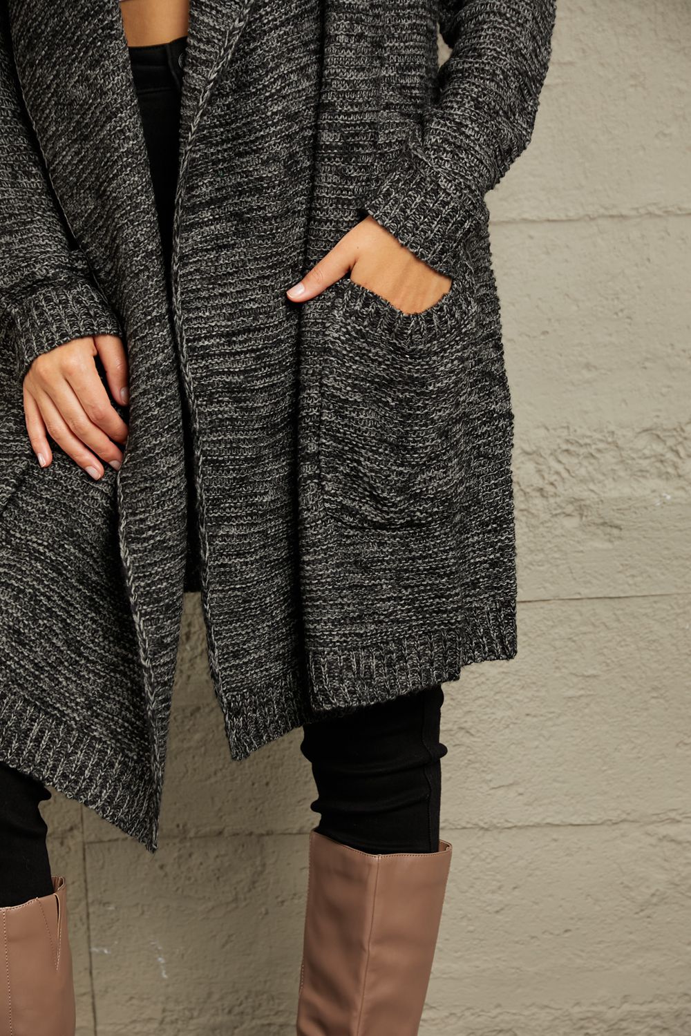 This cardigan envelops you in warmth while exuding a relaxed, yet chic vibe. Its chunky knit texture adds a touch of rustic charm, making it a versatile piece for both casual outings and snug nights in.